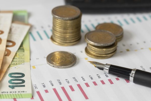 high-angle-coins-banknotes-arrangement