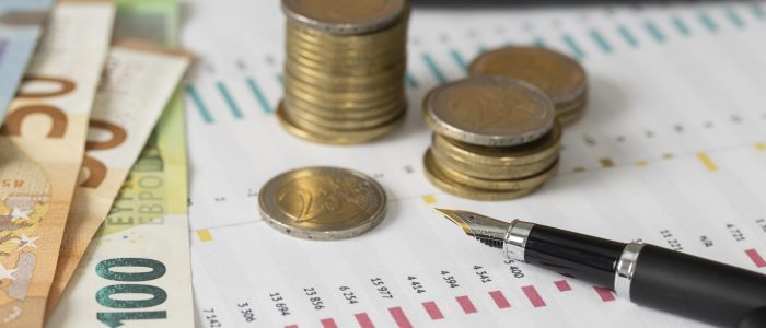 high-angle-coins-banknotes-arrangement